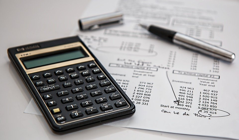 Accounting Forms (1099, W2, etc.) with a pocket calculator